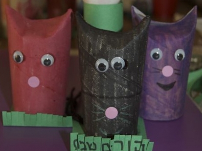 detail of toilet paper roll cats
