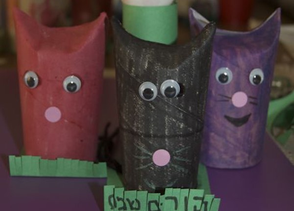detail of toilet paper roll cats