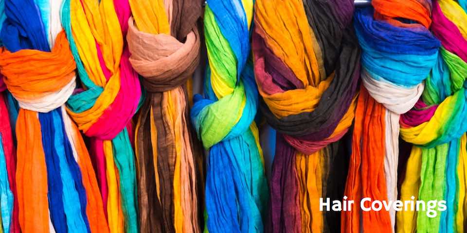 colorful scarves as a backdrop to text hair covering